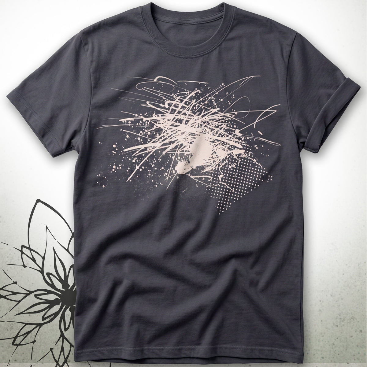 A dark charcoal gray short-sleeve t-shirt with an abstract white paint splatter and scribble graphic on the front, displayed flat against a light gray textured background.
