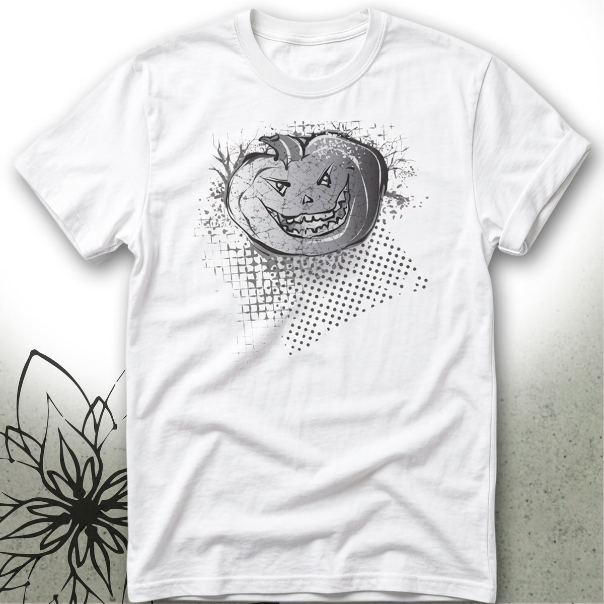 A white short-sleeve crewneck t-shirt featuring a black and gray graphic of a smiling jack-o'-lantern pumpkin with a halftone dot pattern on the front.